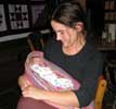 22_holding-baby_natalie_20021021 (35KB)